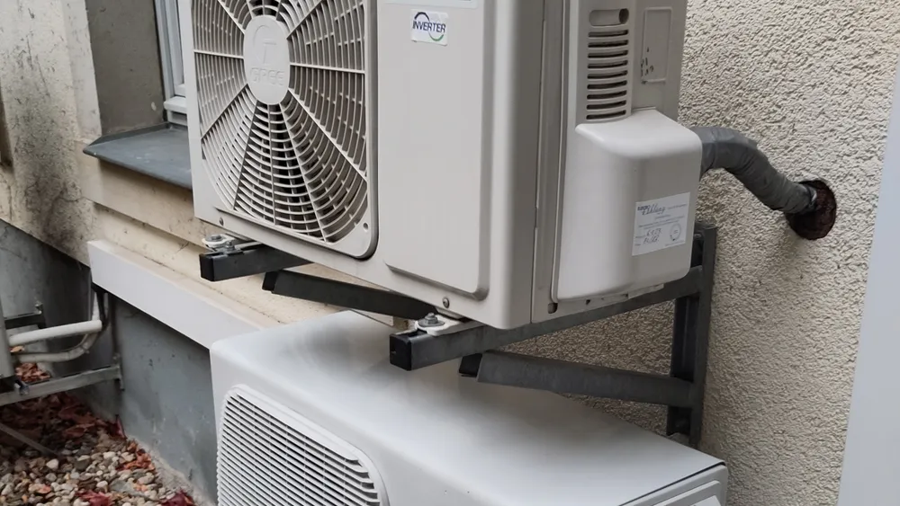 Outdoor condensing units mounted on a building wall.