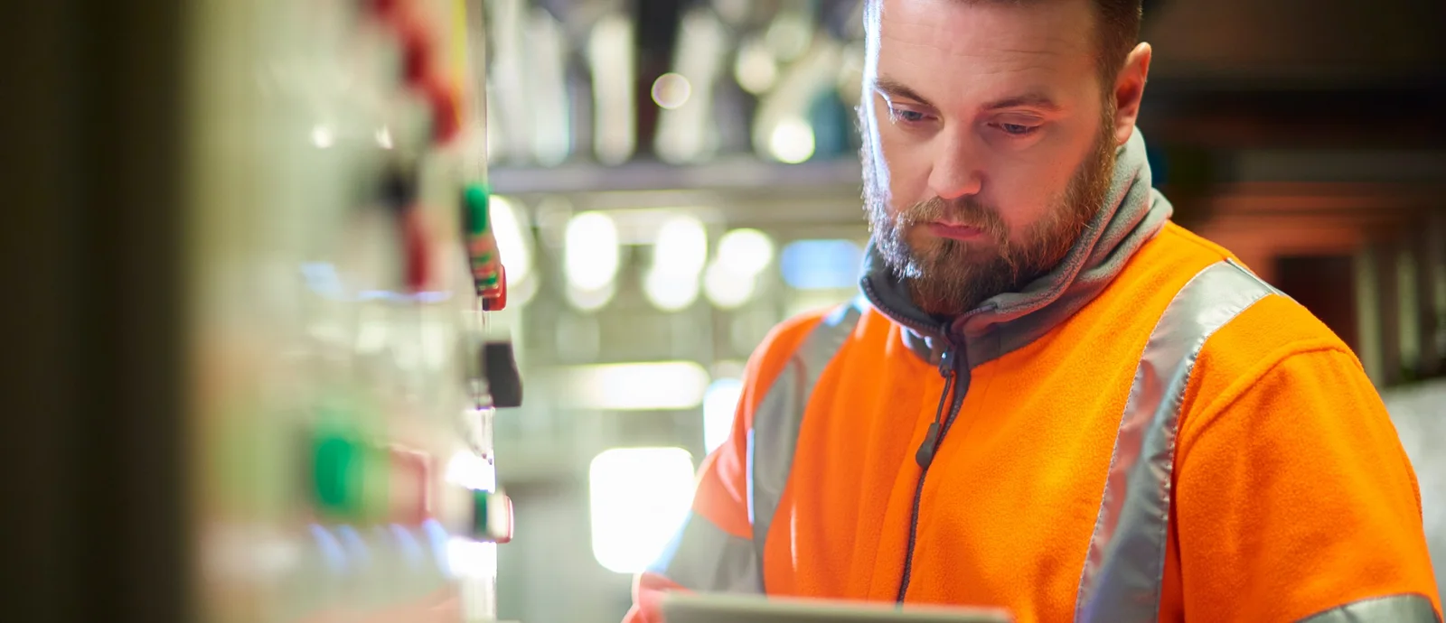A refrigeration technician checking equipment during a service visit.